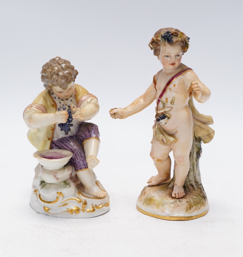 Two Meissen porcelain figures, boys with grapes, largest 13cm high. Condition - poor
